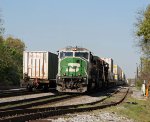 BNSF 8188 leads train 214 past the rear of train 213